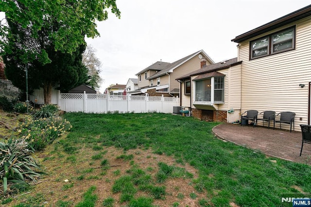 view of yard featuring a patio and fence