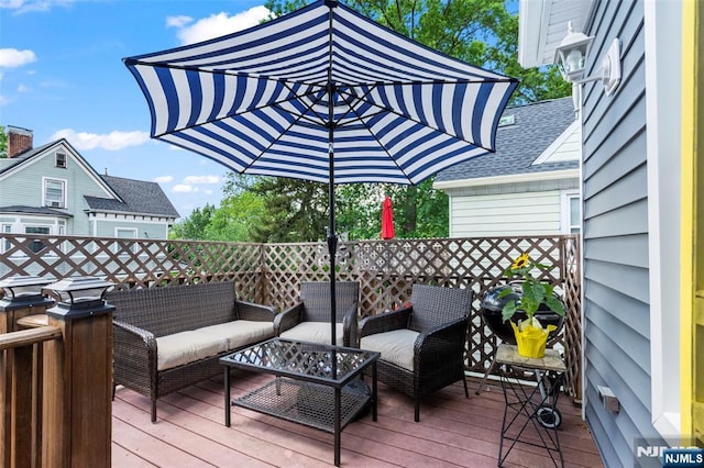 wooden deck featuring an outdoor living space