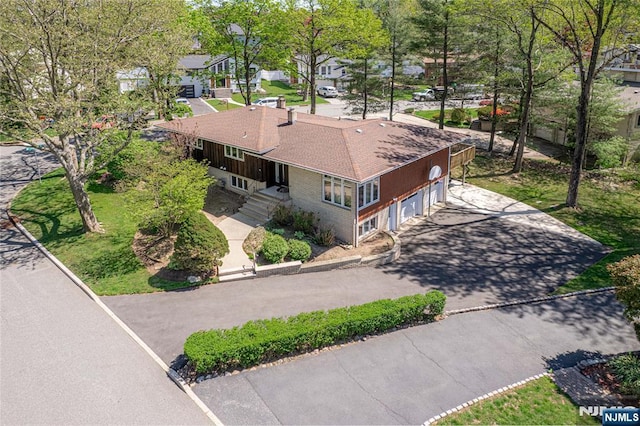 birds eye view of property with a residential view
