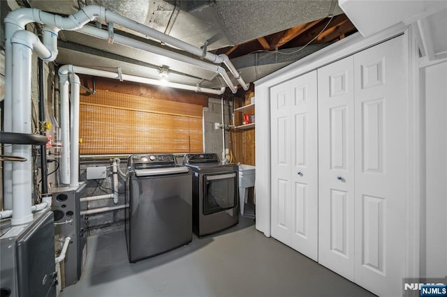 laundry area featuring separate washer and dryer and laundry area