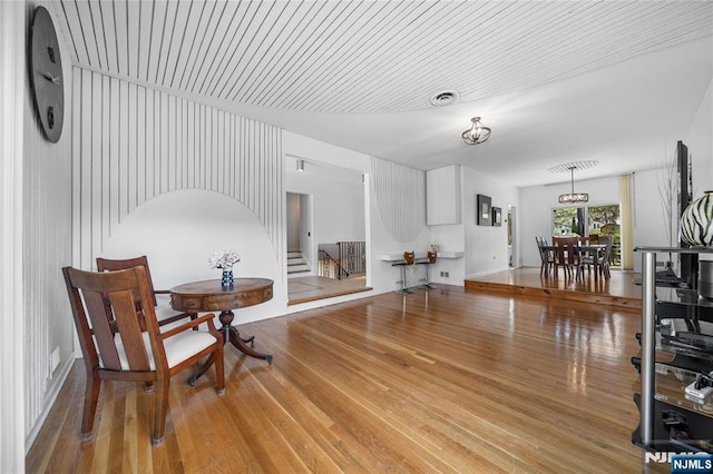 sitting room featuring stairs and wood finished floors