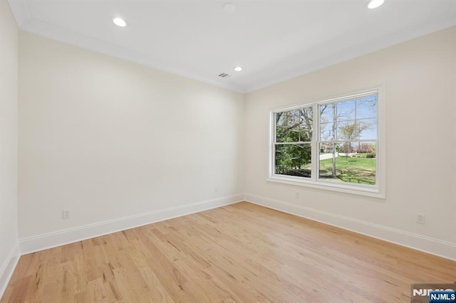 empty room with recessed lighting, baseboards, and light wood finished floors