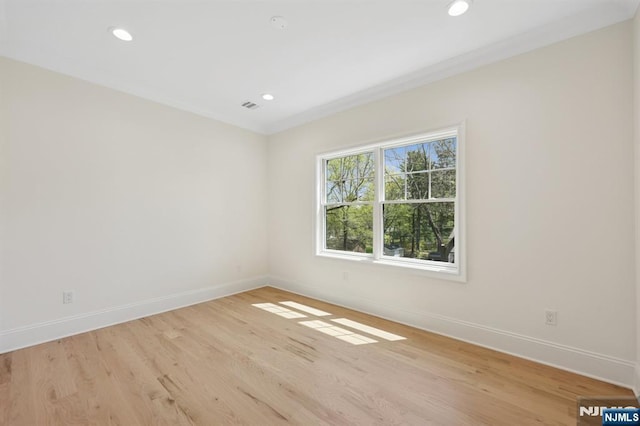 unfurnished room with baseboards, recessed lighting, and light wood-style flooring