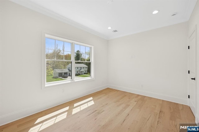 empty room with recessed lighting, baseboards, and light wood-style flooring