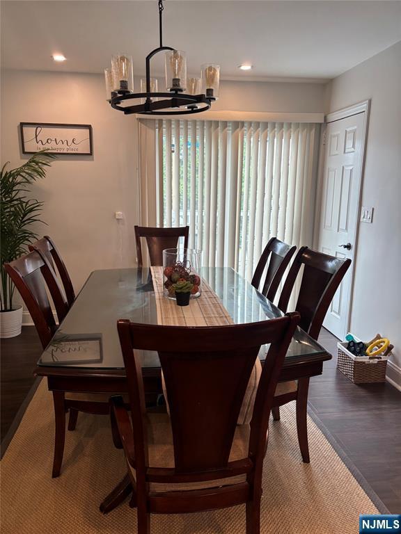 66 Lexington Ave, Rochelle Park, NJ 07662 - dining space with a chandelier, wood finished floors, baseboards, and recessed lighting