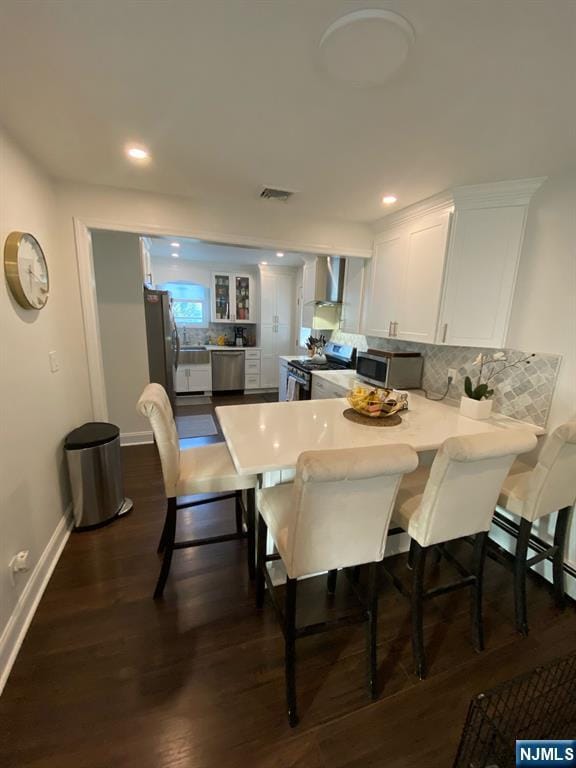 66 Lexington Ave, Rochelle Park, NJ 07662 - dining room with baseboards, recessed lighting, dark wood finished floors, and visible vents