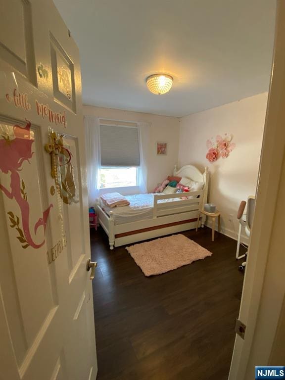 66 Lexington Ave, Rochelle Park, NJ 07662 - bedroom with dark wood-style flooring