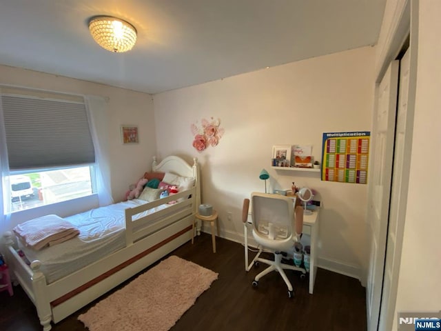 66 Lexington Ave, Rochelle Park, NJ 07662 - bedroom with baseboards and wood finished floors