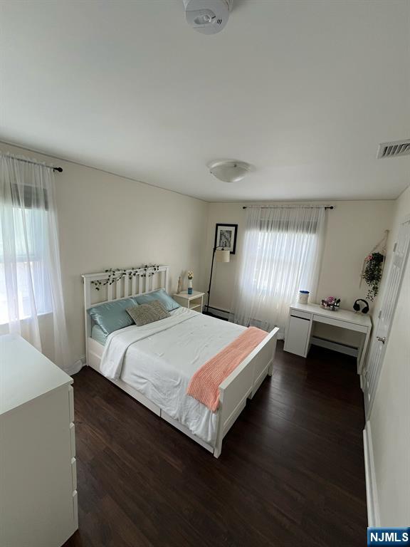 66 Lexington Ave, Rochelle Park, NJ 07662 - bedroom with visible vents and dark wood-style floors