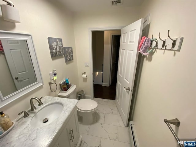 66 Lexington Ave, Rochelle Park, NJ 07662 - bathroom with toilet, marble finish floor, vanity, visible vents, and a baseboard radiator