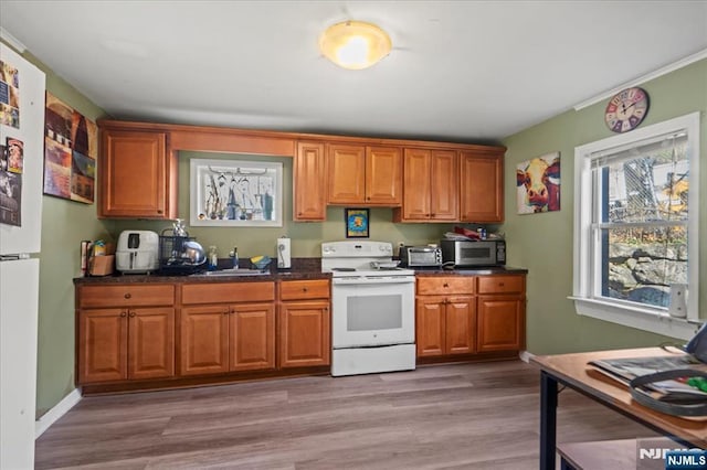 7 White Rd, West Milford, NJ 07421 - kitchen with white appliances, dark countertops, a wealth of natural light, and a sink