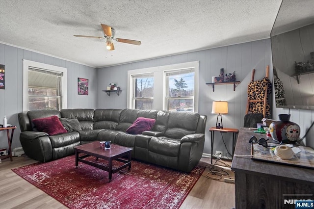 7 White Rd, West Milford, NJ 07421 - living area with crown molding, a textured ceiling, ceiling fan, and wood finished floors