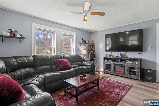 7 White Rd, West Milford, NJ 07421 - living room with a textured ceiling, ceiling fan, and wood finished floors