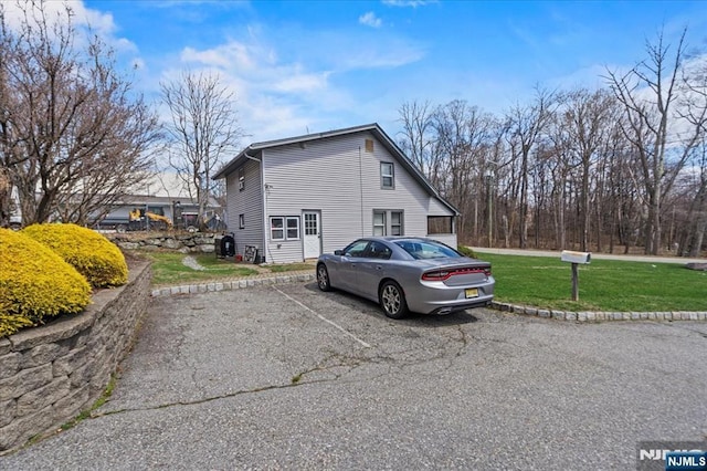 7 White Rd, West Milford, NJ 07421 - view of home's exterior with a lawn and uncovered parking