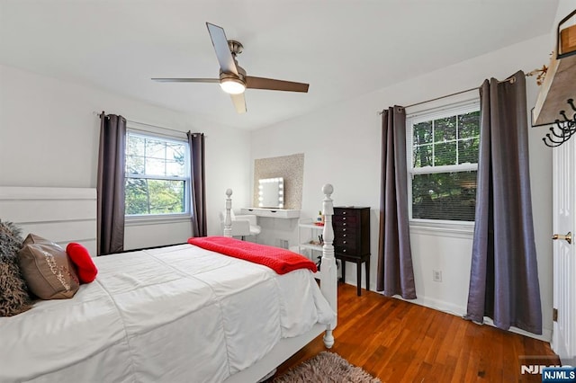 bedroom featuring a ceiling fan and wood finished floors