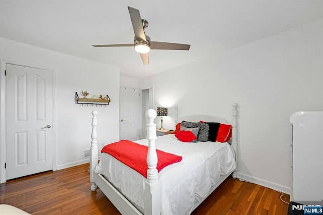 bedroom with baseboards, a ceiling fan, and wood finished floors