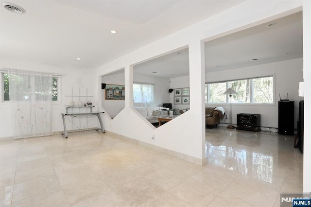 interior space featuring visible vents, recessed lighting, light tile patterned floors, and a healthy amount of sunlight