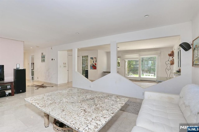 living room with light tile patterned floors