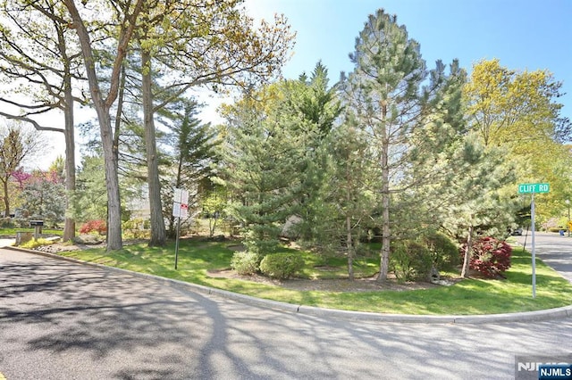 exterior space with curbs and traffic signs
