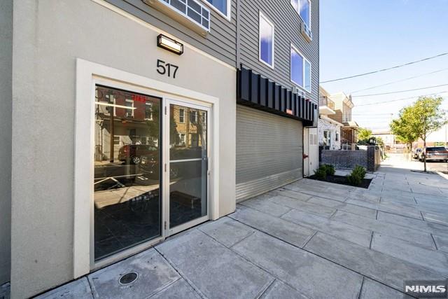 property entrance featuring a patio and stucco siding