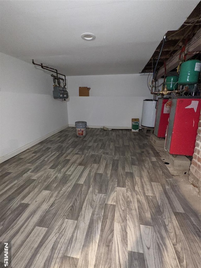 finished basement with wood finished floors and water heater