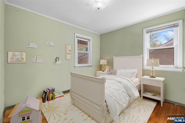 98 Roosevelt Blvd, Oakland, NJ 07436 - bedroom featuring ornamental molding, wood finished floors, and multiple windows
