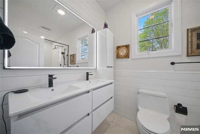 143 S Glen Rd, Kinnelon Borough, NJ 07405 - bathroom with a sink, a wainscoted wall, a healthy amount of sunlight, and marble finish floor