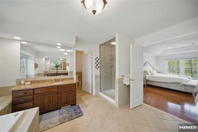 143 S Glen Rd, Kinnelon Borough, NJ 07405 - full bath featuring vanity, tile patterned floors, a stall shower, and connected bathroom