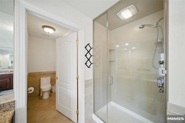 143 S Glen Rd, Kinnelon Borough, NJ 07405 - full bath featuring vanity, toilet, tile patterned floors, a wainscoted wall, and a shower stall