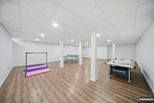 143 S Glen Rd, Kinnelon Borough, NJ 07405 - playroom with baseboards, a drop ceiling, recessed lighting, and wood finished floors