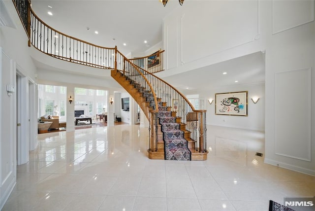 143 S Glen Rd, Kinnelon Borough, NJ 07405 - interior space with a high ceiling, tile patterned floors, recessed lighting, baseboards, and ornamental molding