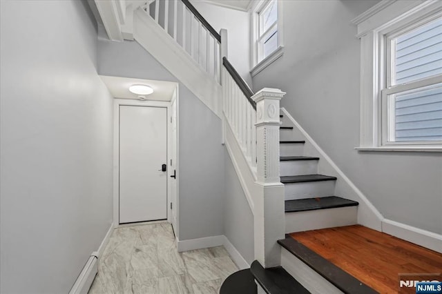 1026 Grove St, Irvington, NJ 07111 - stairway with baseboards, marble finish floor, and a wealth of natural light