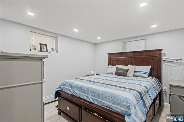 1026 Grove St, Irvington, NJ 07111 - bedroom with recessed lighting, baseboards, and a baseboard heating unit