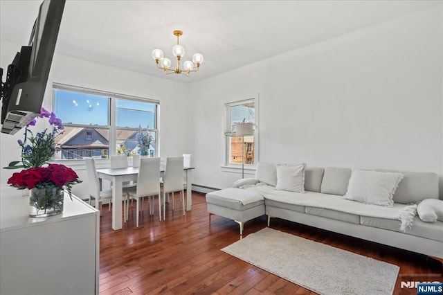1026 Grove St, Irvington, NJ 07111 - living area featuring plenty of natural light, wood-type flooring, a baseboard heating unit, and a chandelier