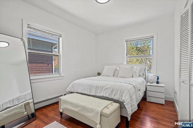 1026 Grove St, Irvington, NJ 07111 - bedroom with a baseboard heating unit and hardwood / wood-style floors