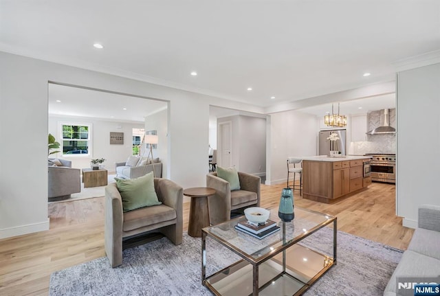 living area featuring recessed lighting, light wood-style flooring, and baseboards