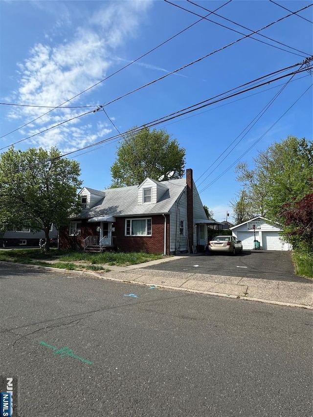 new england style home with brick siding and a chimney