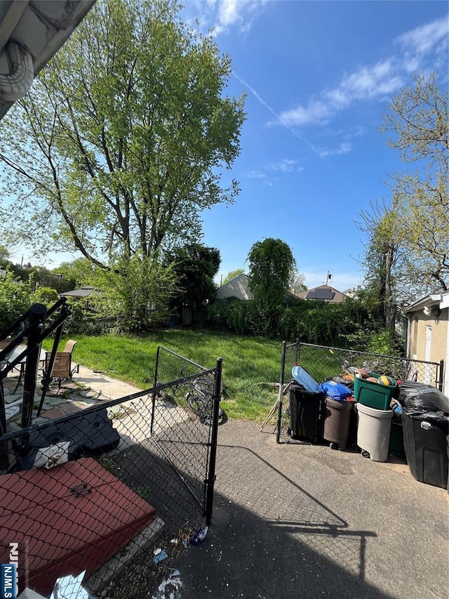 view of yard featuring a patio and fence