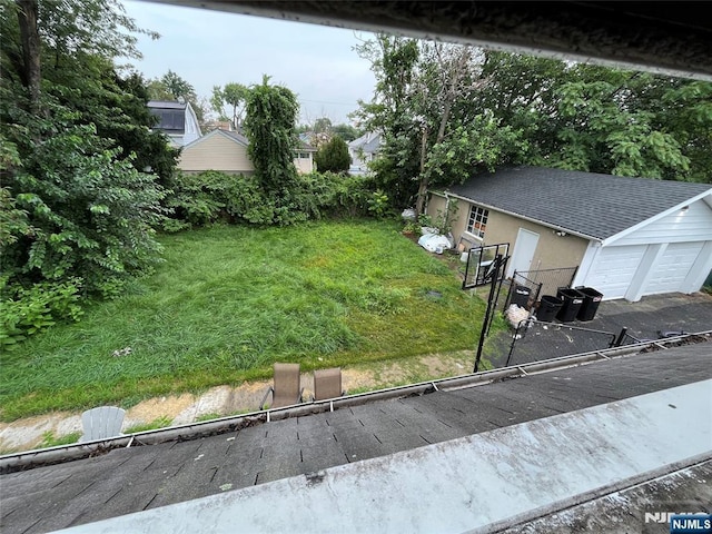 view of yard featuring a garage