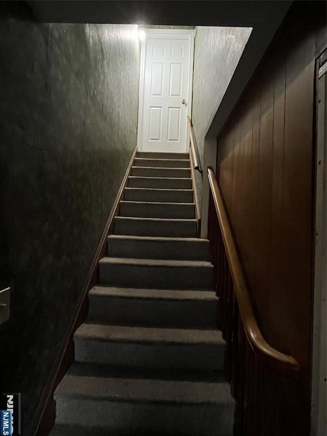 stairs with a textured wall