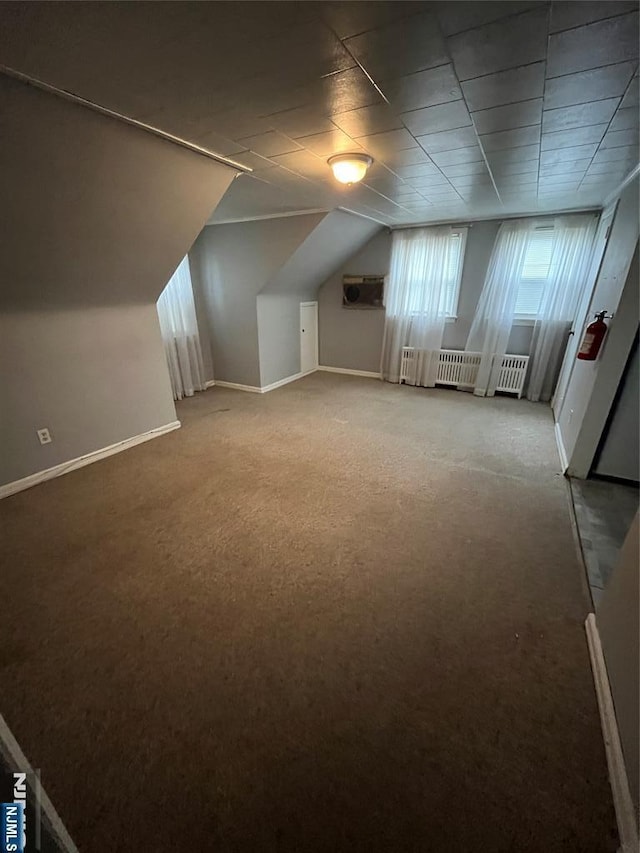 bonus room with carpet floors and baseboards