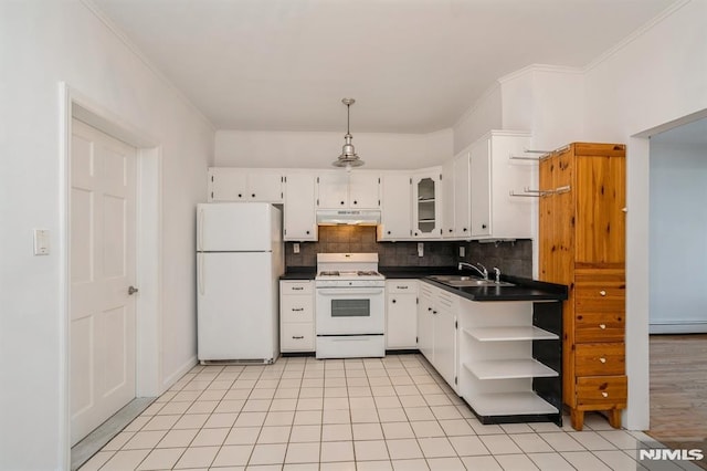 118 W 49th St, Bayonne, NJ 07002 - kitchen featuring dark countertops, baseboard heating, open shelves, under cabinet range hood, and white appliances