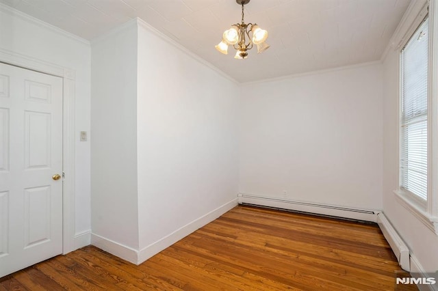 118 W 49th St, Bayonne, NJ 07002 - empty room with crown molding, a baseboard radiator, wood finished floors, and a chandelier