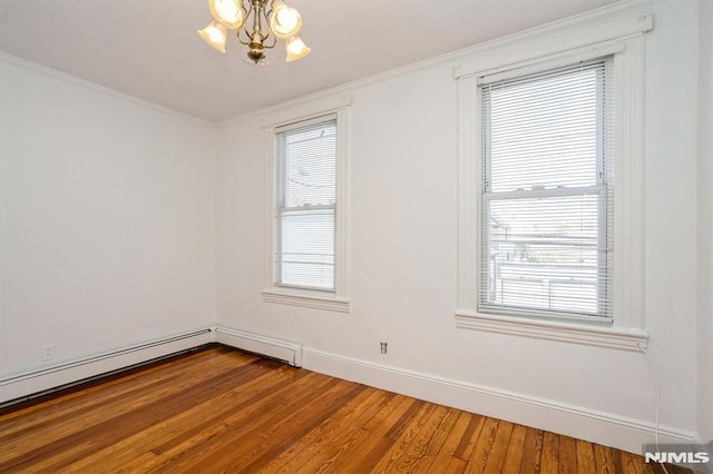 118 W 49th St, Bayonne, NJ 07002 - empty room with a notable chandelier, ornamental molding, hardwood / wood-style floors, and plenty of natural light
