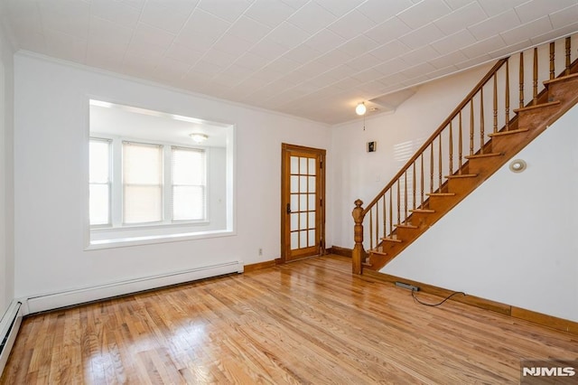 118 W 49th St, Bayonne, NJ 07002 - interior space featuring crown molding, stairs, baseboards, wood finished floors, and a baseboard heating unit