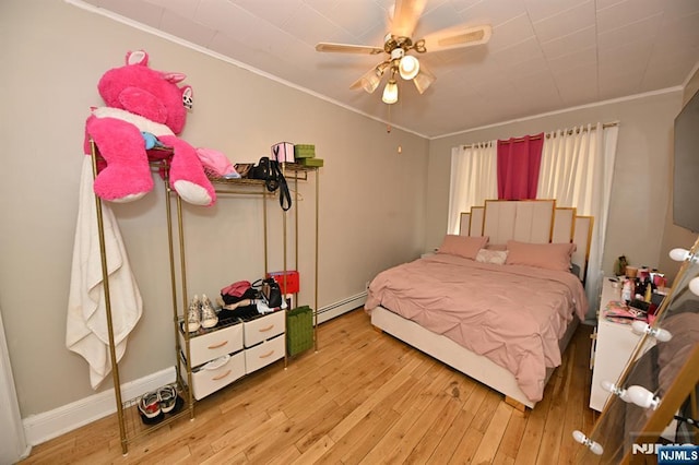 72 Van Winkle Ave, Garfield, NJ 07026 - bedroom with ornamental molding, baseboard heating, a ceiling fan, and hardwood / wood-style floors