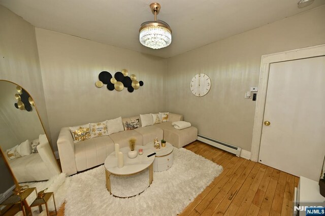 72 Van Winkle Ave, Garfield, NJ 07026 - living area featuring hardwood / wood-style flooring and a baseboard radiator