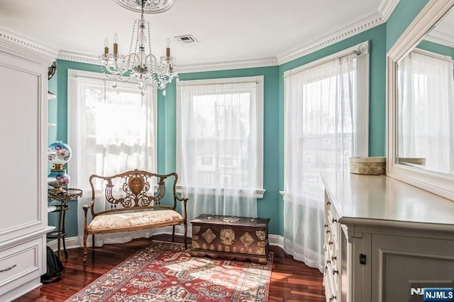 142 Brookfield Ave, Nutley, NJ 07110 - living area with dark wood-style flooring, visible vents, crown molding, baseboards, and an inviting chandelier