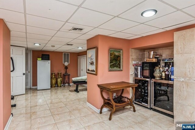 142 Brookfield Ave, Nutley, NJ 07110 - interior space with baseboards, visible vents, a drop ceiling, and wine cooler