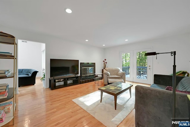 living area featuring recessed lighting and light wood-type flooring